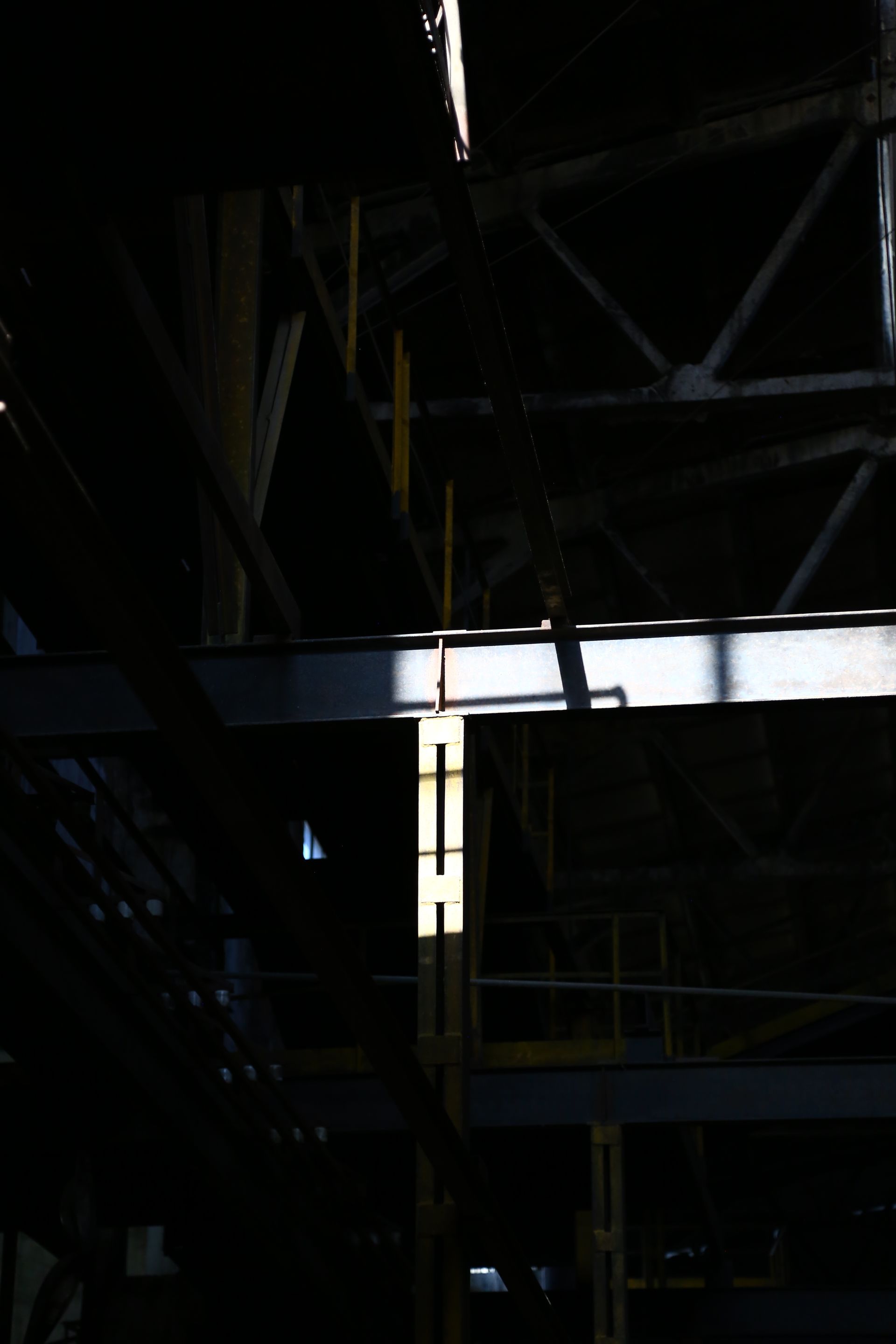 Interior of a modern industrial facility with structural steel framework, representing the engineered foundations Laplasco builds for its clients